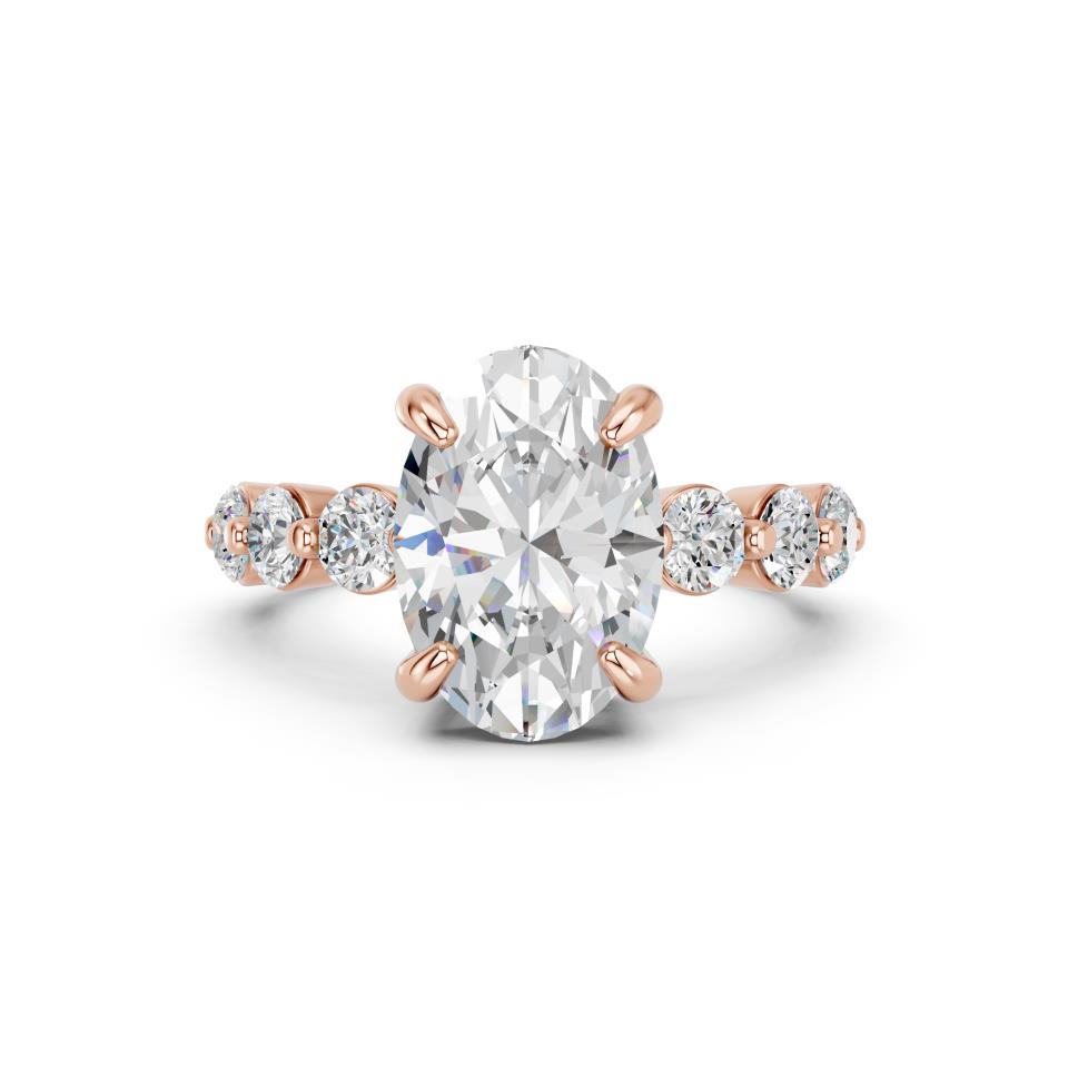 OVAL RING WITH ROUND SIDE STONES