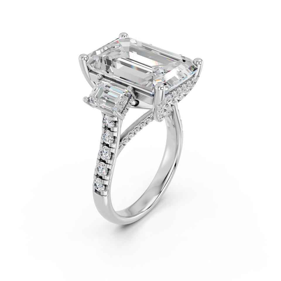EMERALD THREE STONE RING WITH HIDDEN HALO AND PAVE BAND