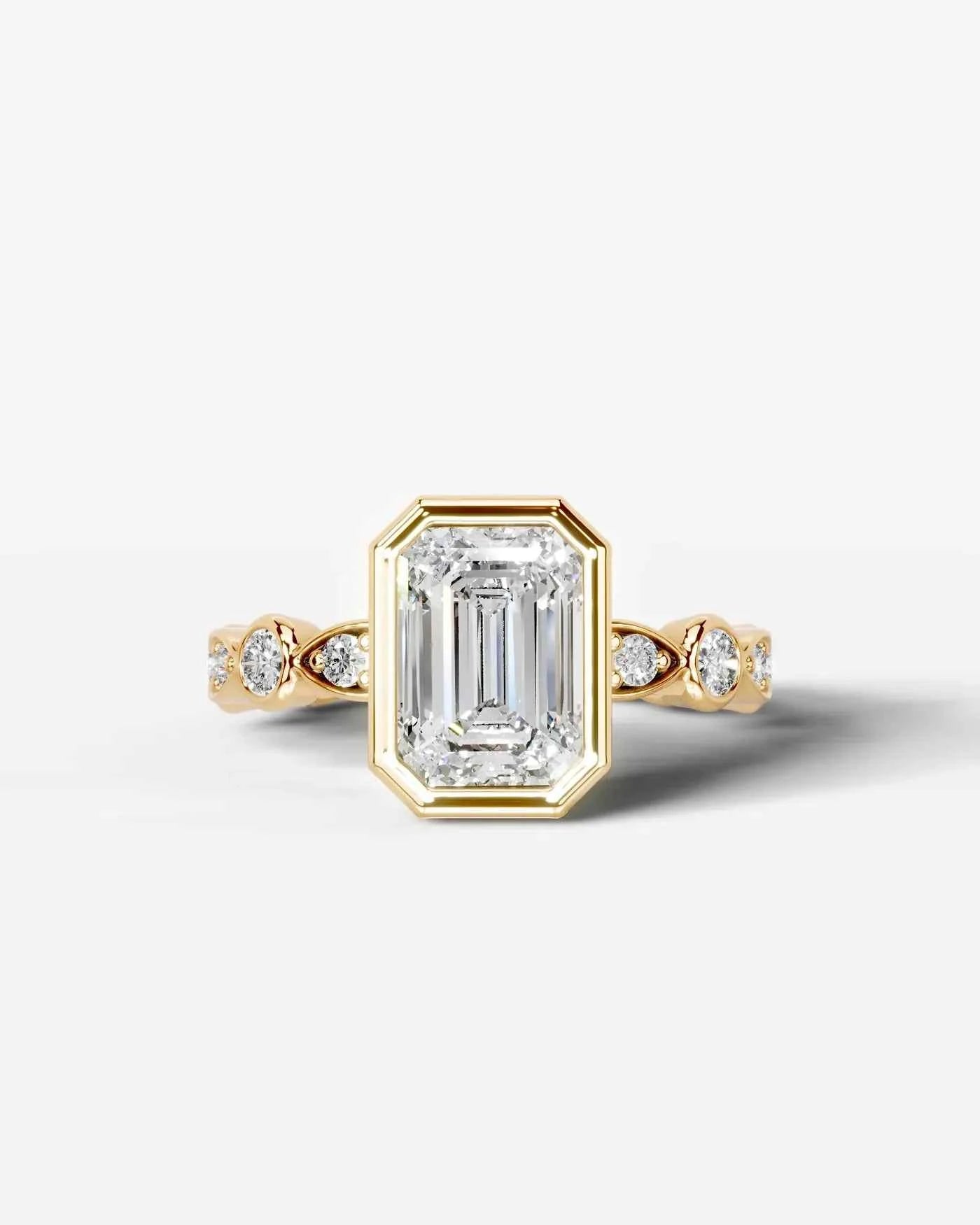 Emerald Cut Lab Diamond bezel Engagement Ring with bezel set side stones| D VS1