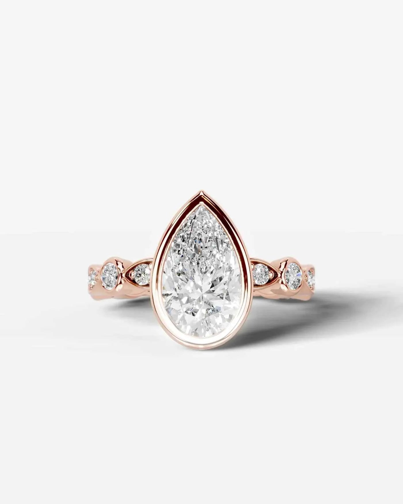 Pear Cut Lab Diamond bezel Engagement Ring with bezel set side stones| D VS1