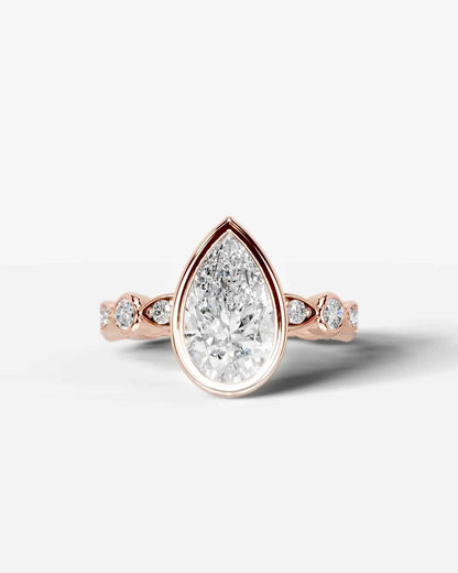 Pear Cut Lab Diamond bezel Engagement Ring with bezel set side stones| D VS1