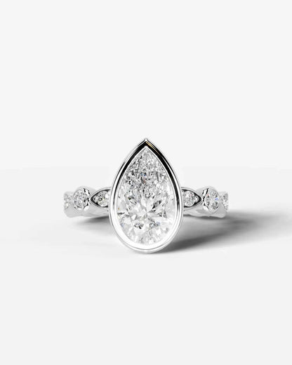 Pear Cut Lab Diamond bezel Engagement Ring with bezel set side stones| D VS1