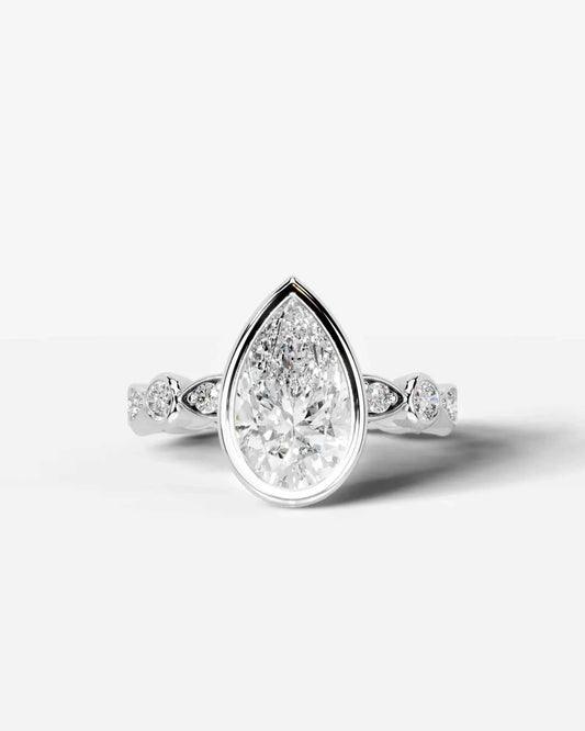 Pear Cut Lab Diamond bezel Engagement Ring with bezel set side stones| D VS1