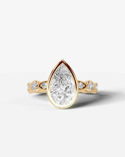 Pear Cut Lab Diamond bezel Engagement Ring with bezel set side stones| D VS1