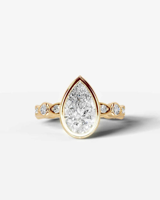Pear Cut Lab Diamond bezel Engagement Ring with bezel set side stones| D VS1