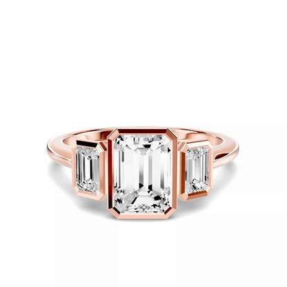 EMERALD THREE STONE BEZEL RING