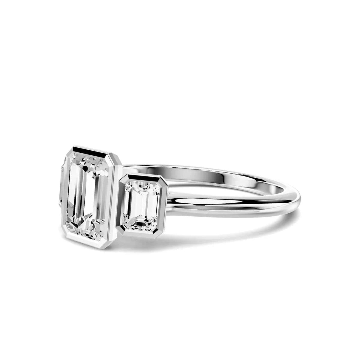 EMERALD THREE STONE BEZEL RING