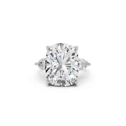 CUSHION THREE STONE RING WITH PEAR SIDE STONES AND HIDDEN HALO