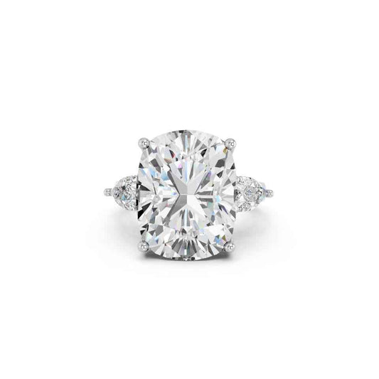 CUSHION THREE STONE RING WITH PEAR SIDE STONES AND HIDDEN HALO