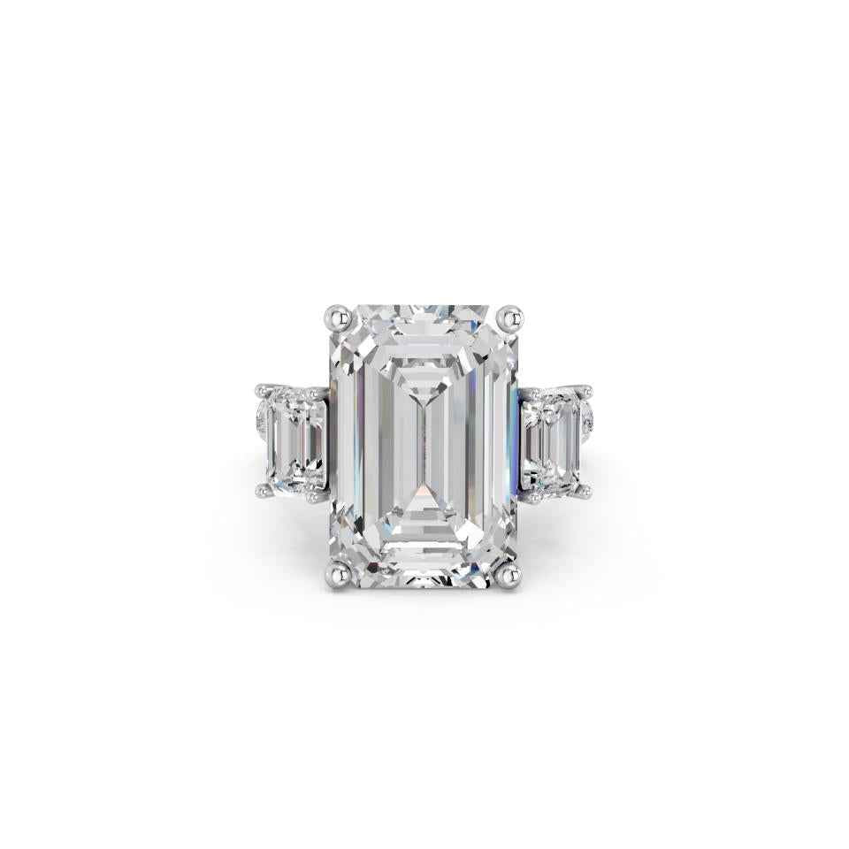 EMERALD THREE STONE RING WITH HIDDEN HALO AND PAVE BAND