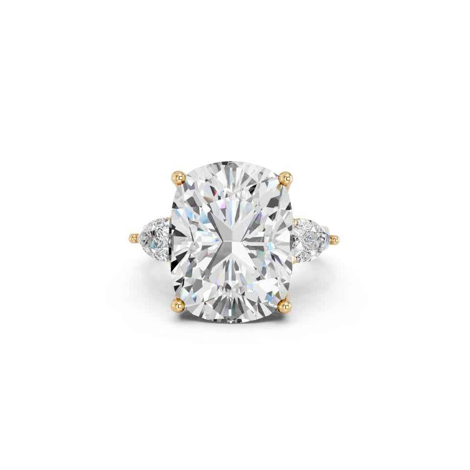 CUSHION THREE STONE RING WITH PEAR SIDE STONES AND HIDDEN HALO