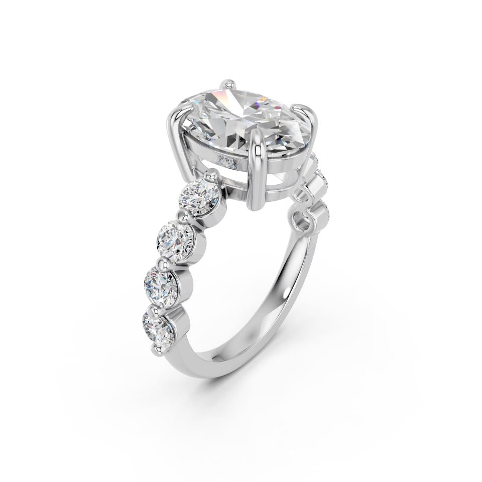 OVAL RING WITH ROUND SIDE STONES