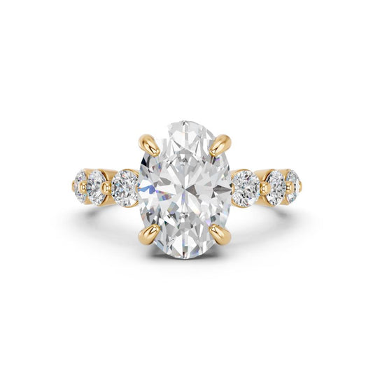 OVAL RING WITH ROUND SIDE STONES