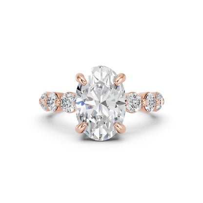 OVAL RING WITH ROUND SIDE STONES