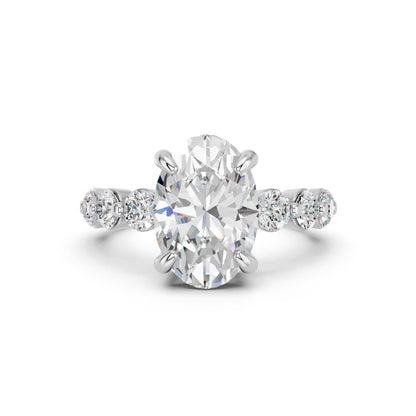 OVAL RING WITH ROUND SIDE STONES