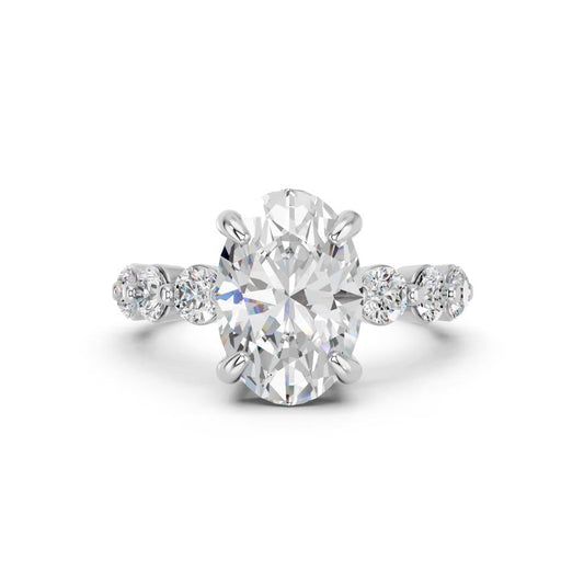 OVAL RING WITH ROUND SIDE STONES