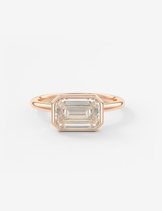 EMERALD EAST WEST WITH BEZEL RING