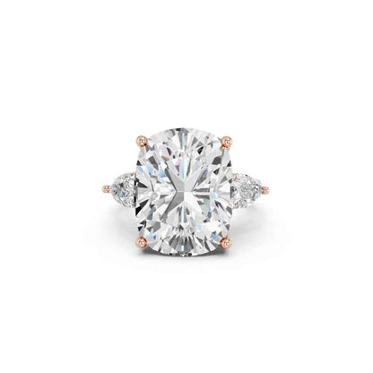CUSHION THREE STONE RING WITH PEAR SIDE STONES AND HIDDEN HALO