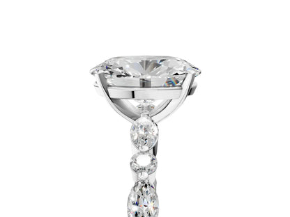 Oval Cut Diamond Ring with Marquise and Round Side Stones and Four-Prong Setting| D VS1