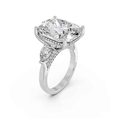 CUSHION THREE STONE RING WITH PEAR SIDE STONES AND HIDDEN HALO