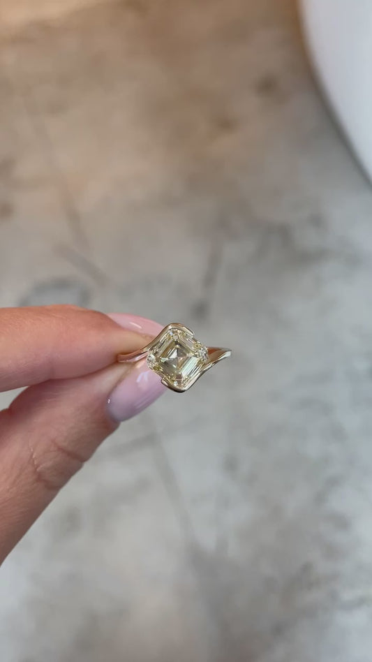 YELLOW ASSCHER WITH KITE SETTING