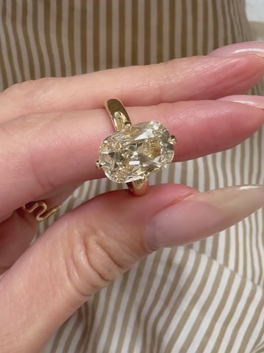 YELLOW CUSHION RING IN COMPASS SETTING