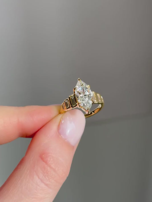 MARQUISE RING WITH BAGUETTE SIDE STONES