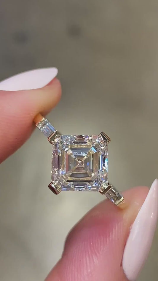 ASSCHER RING WITH BAGUETTE SIDE STONES IN KITE SETTING