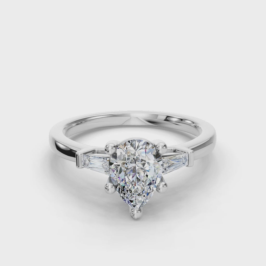 PEAR BAGUETTE THREE STONE RING