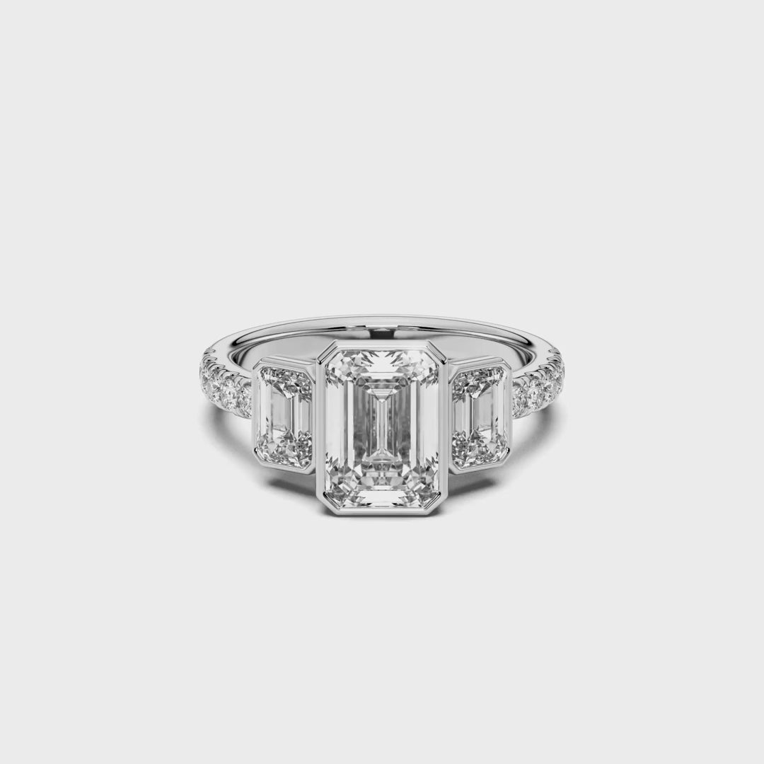 EMERALD BEZEL 3 STONE RING