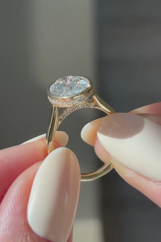 OVAL BEZEL RING WITH HIDDEN HALO