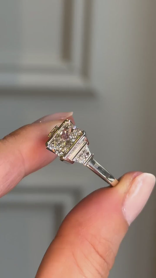 RADIANT HALF BEZEL RING WITH TRAPZOID SIDE STONES