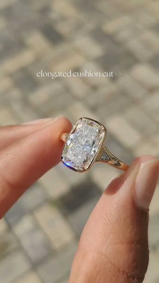 CUSHION RING WITH SIDE STONES